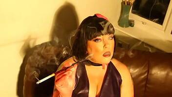 Latex Clad BBW Tina Snua Smoking A Cork Cigarette In A Long Holder - Glove Fetish - Britain on femdomerotic.com