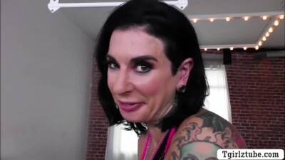 Tattooed milf fucked by super star shemale on femdomerotic.com