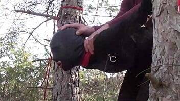 Tied up to a tree outdoor on sexy clothes, wearing pantyhose and high ankle boots heels, rough fuck on femdomerotic.com