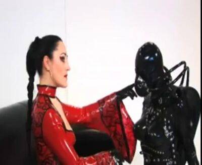 Tantalizing mistress enjoys BDSM and femdom with her submissive slaves on femdomerotic.com