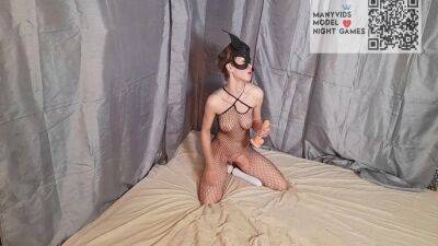 Girl In A Mask And A Mesh On The Body Sucks And Fucks A Dildo on femdomerotic.com