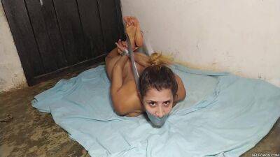 Hysterical Bondage Prisoner Hogtied Naked And Squirming In The Basement! on femdomerotic.com