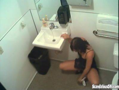 Piss fetish office whore peeing in the pot on femdomerotic.com