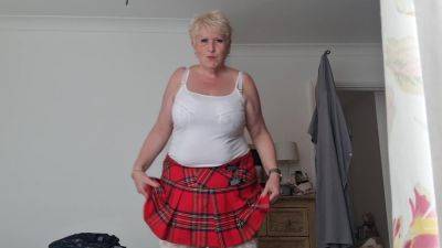 Tartan Skirt Stockings And White See Thru Panties on femdomerotic.com
